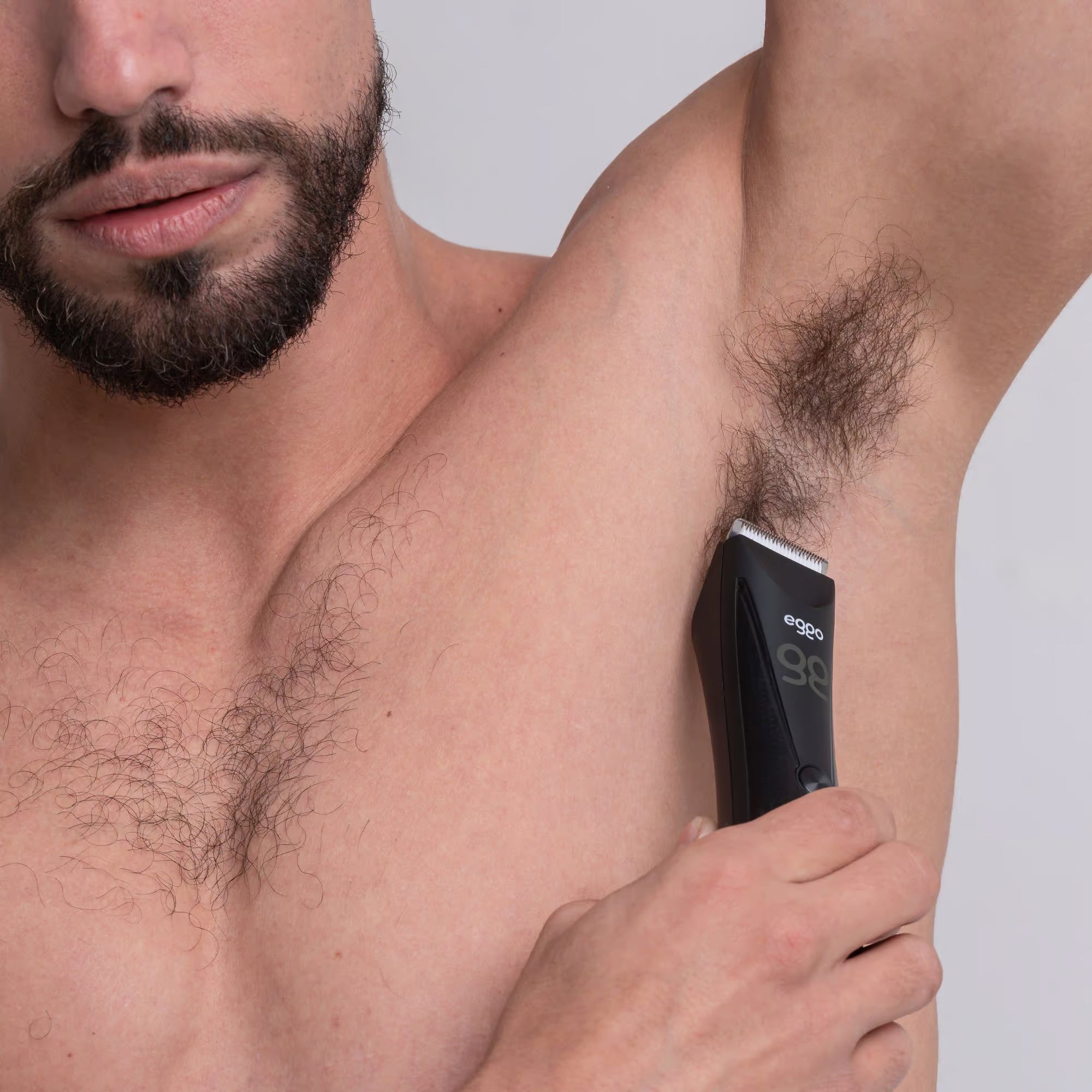 EGGO Trimmer on charging base with oil and brush