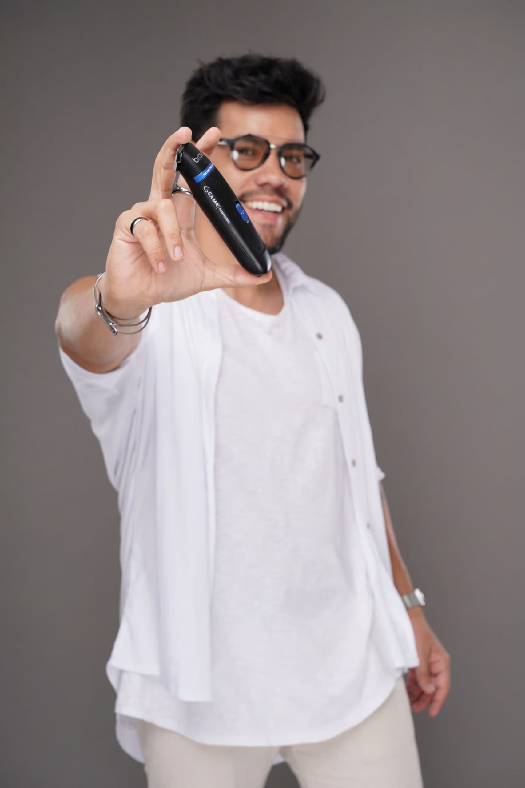 Bravo Gear Trimmer on charging base with oil and brush